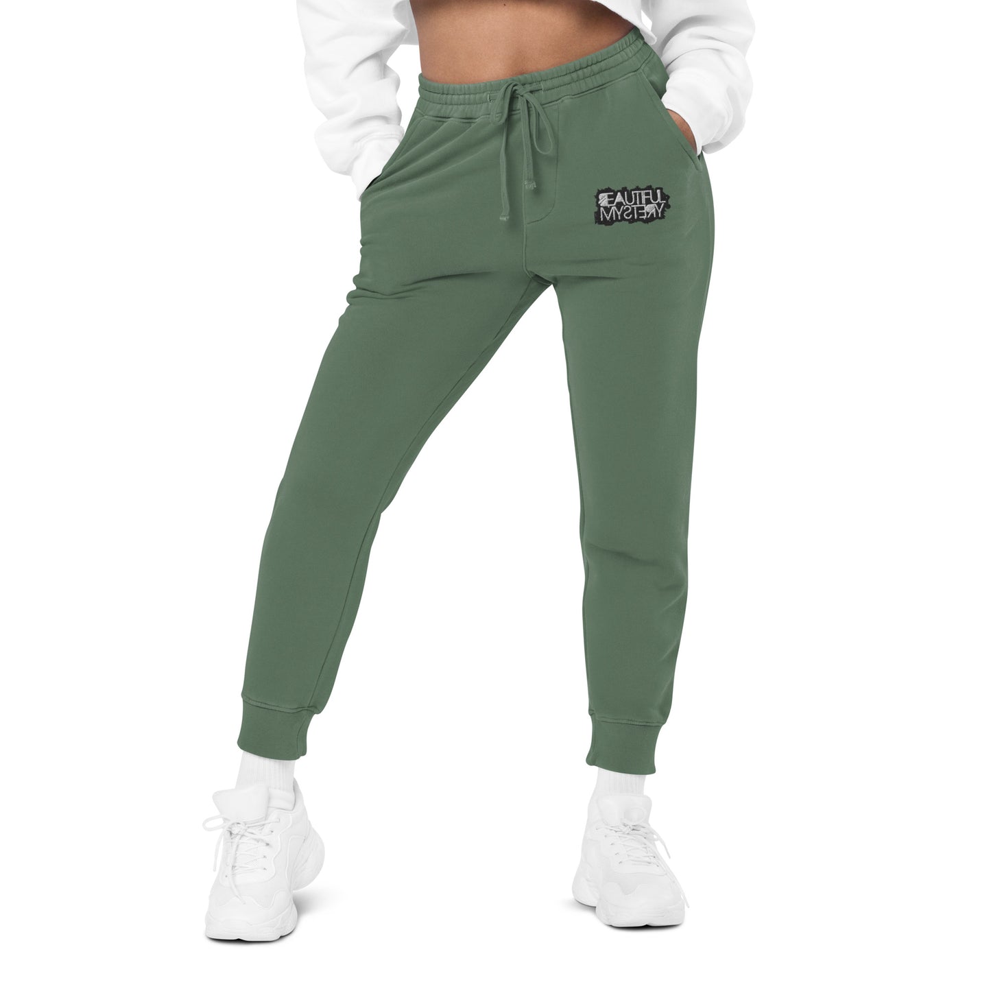 green women's jogger pants featuring a white logo on the side, designed for comfort and casual wear.