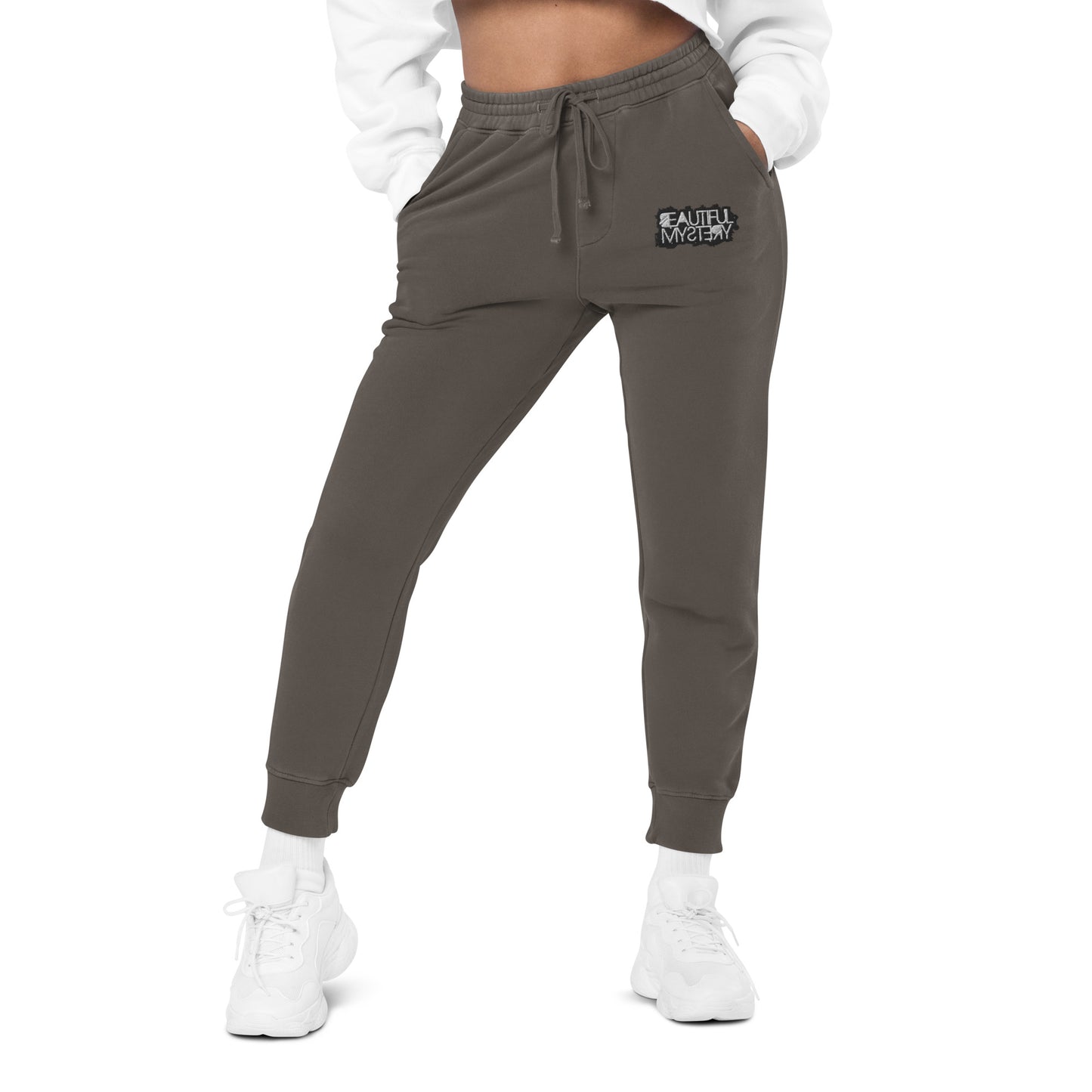 Grey women's jogger pants featuring a white logo on the side, designed for comfort and casual wear.