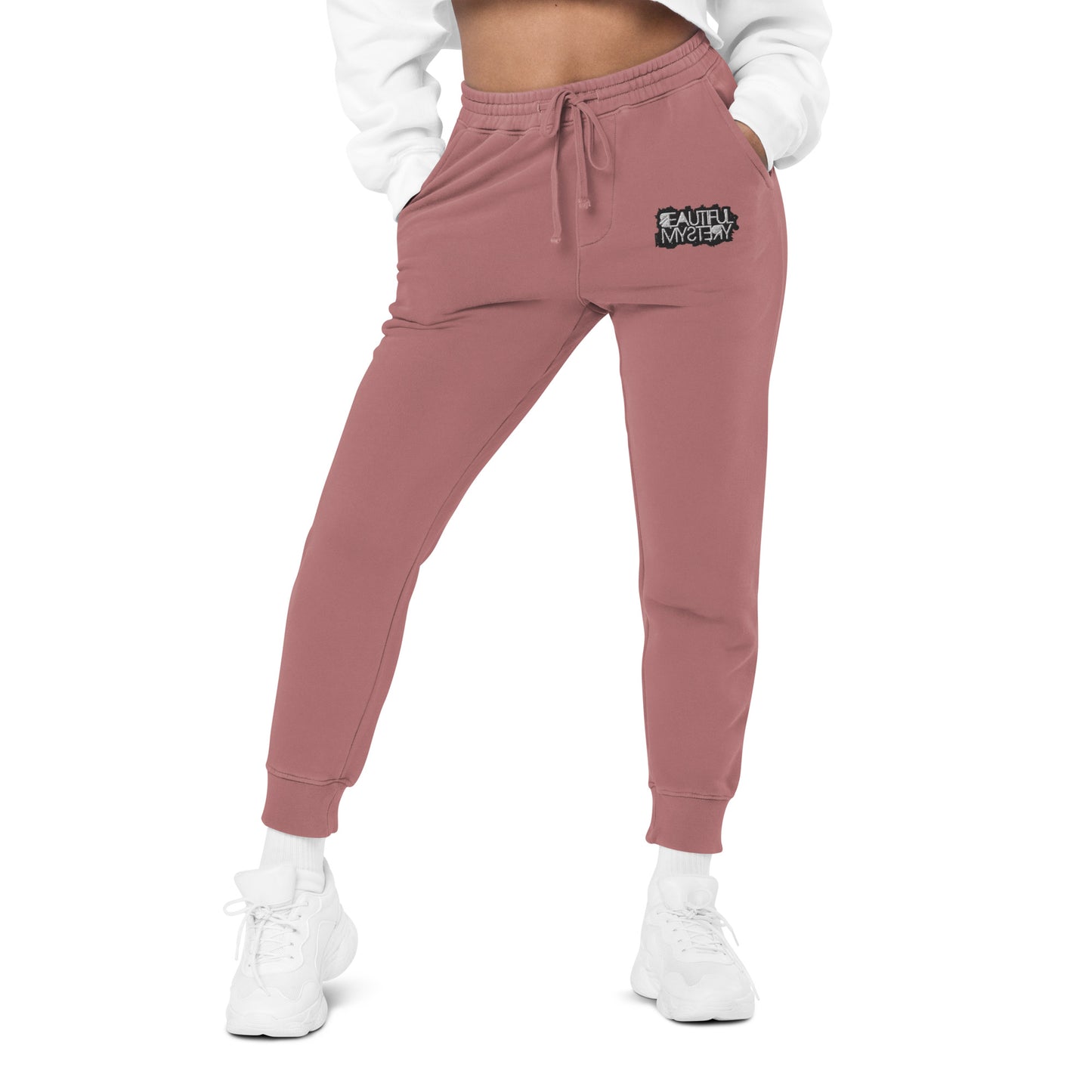 pink women's jogger pants featuring a white logo on the side, designed for comfort and casual wear.