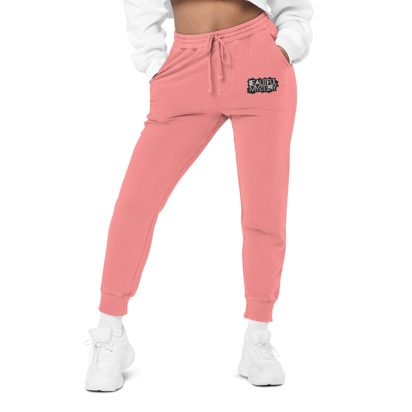 pink women's jogger pants featuring a white logo on the side, designed for comfort and casual wear.